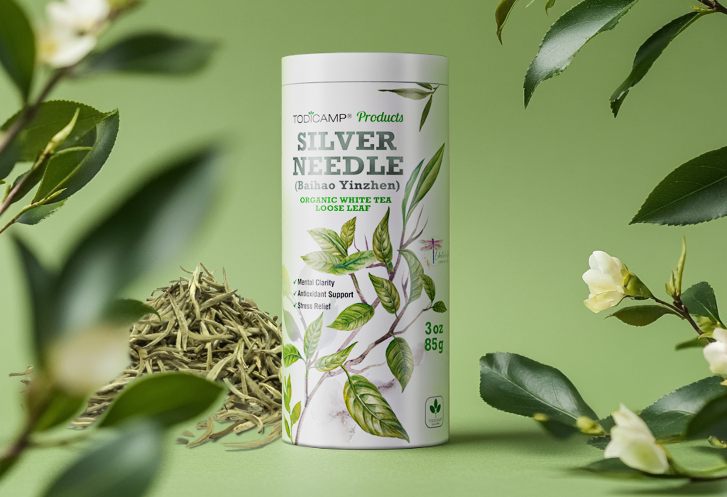 Tea canister labeled 'Silver Needle' surrounded by tea leaves and flowers on a green background